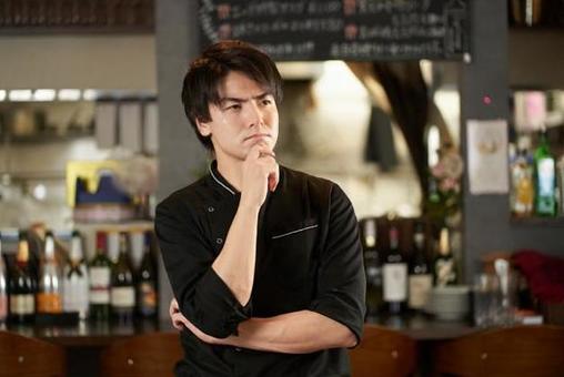 Asian man worried at a restaurant Asian man worried at a restaurant
