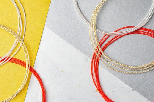 金銀と赤の水引が重なる和風背景素材 水引,背景,素材の写真素材