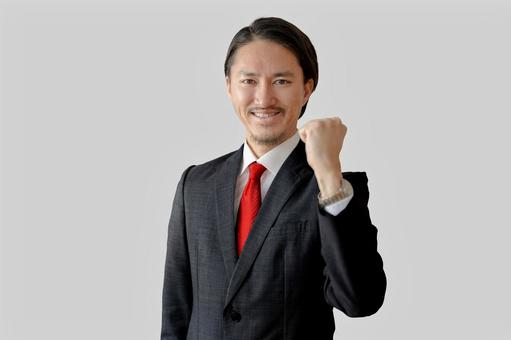 ガッツポーズするビジネスマン 男性,ビジネス,ビジネスマンの写真素材