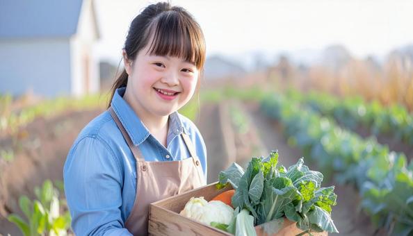 農場で働くダウン症の女性 野菜収穫 農場で働くダウン症の女性 野菜収穫の写真