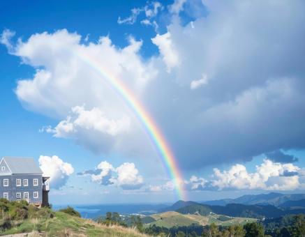 虹がかかる大草原と青空の風景写真 虹がかかる大草原と青空の風景写真の写真