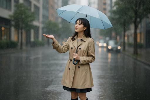 雨粒を手で受け止める女性 雨粒を手で受け止める女性の写真