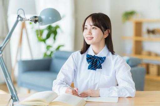 自宅で勉強をする女子高生 高校生,女子,笑顔の写真素材