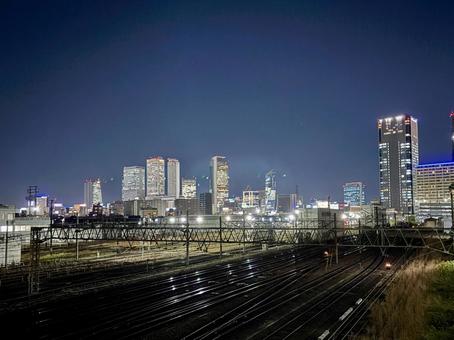 名古屋駅のビル群を望む　向野橋から 夜景,名古屋,線路の写真素材