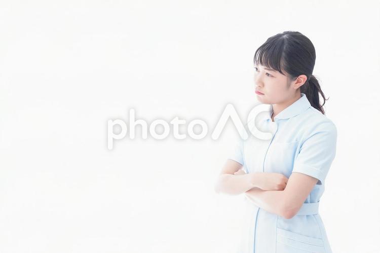 怒りを感じる若い看護師 看護婦,収入,福祉の写真素材