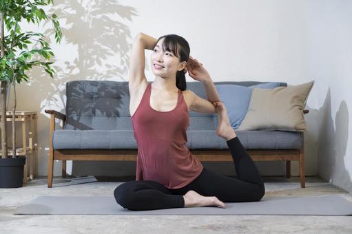 A woman doing yoga in the living space, female, yoga, indoor, JPG