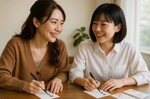 年賀状を書く二人の写真