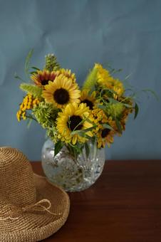 Sunflower arrangement and straw hat, JPG