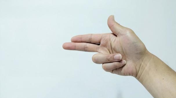 左を指さす右手のサイン 左を指さす右手のサインの写真