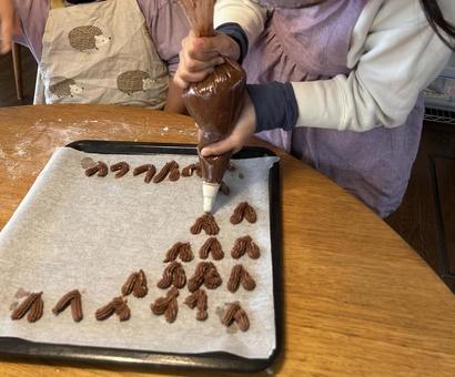 Child making heart-shaped cookies, JPG Child making heart-shaped cookies, JPG