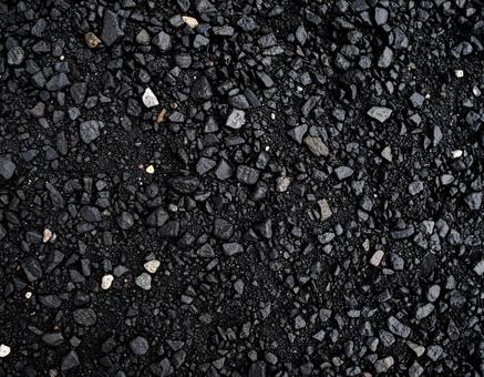 小石が混じった黒い道路のテクスチャ 小石が混じった黒い道路のテクスチャの写真