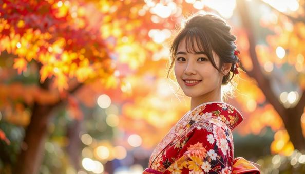 紅葉を眺める晴れ着姿の女性のポートレートの写真