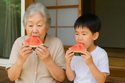 縁側でスイカを食べる祖母と孫・夏の風物詩 縁側でスイカを食べる祖母と孫・夏の風物詩の写真