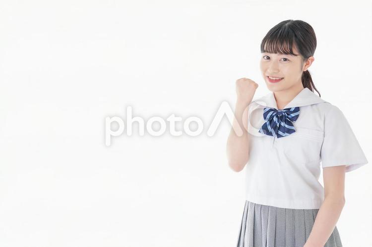 ガッツポーズをする笑顔の女子学生 国家試験,進路,評価の写真素材