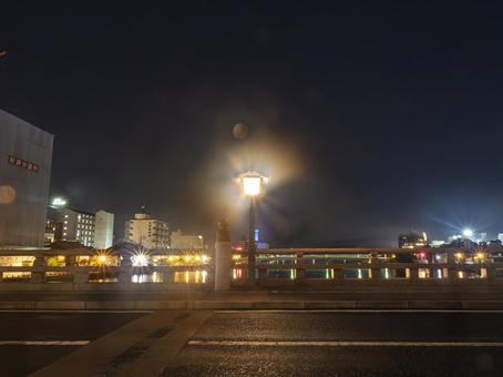 The lights of the bridge illuminating the city at night, JPG The lights of the bridge illuminating the city at night, JPG