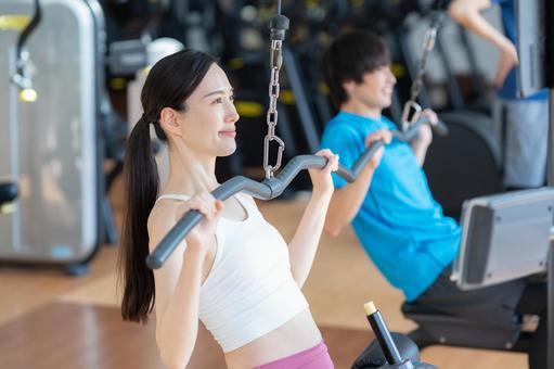 スポーツジムでトレーニングをする若い男女 スポーツジム,フィットネス,ダイエットの写真素材