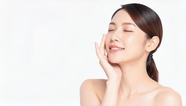 ビューティー 肌を満足げに触る女性 ビューティー 肌を満足げに触る女性の写真