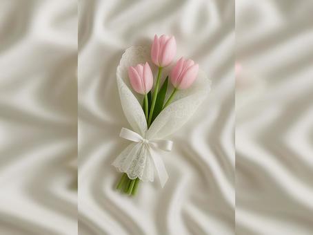 サテンに広がるピンクのチューリップの花束 サテンに広がるピンクのチューリップの花束の写真