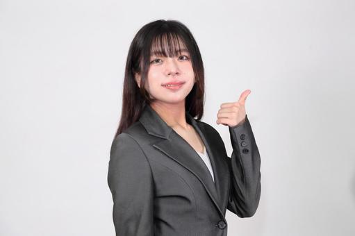 サムアップする女性 サムアップする女性 女性,パンツスーツ,人物の写真素材