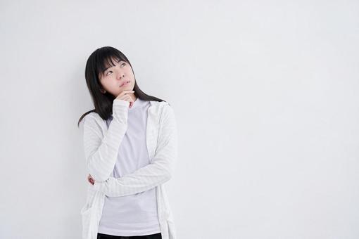 Junior high school girls thinking about ideas on a white background, JPG Junior high school girls thinking about ideas on a white background, JPG