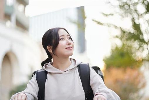 Asian female delivering food Asian female delivering food