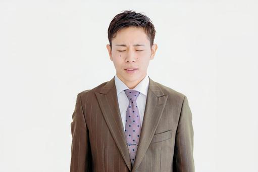 目を閉じて考えるビジネスマン ストレス,リストラ,落ち込むの写真素材
