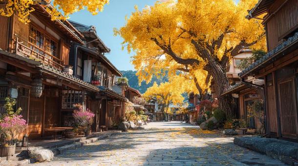 黄金のイチョウ並木と日本の街並みの写真