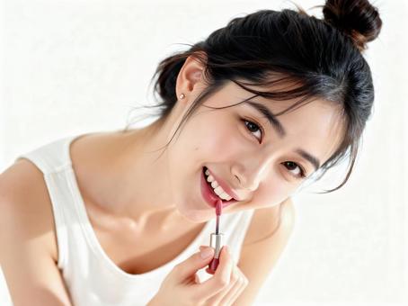 リップグロスを塗る笑顔の若い女性 リップグロスを塗る笑顔の若い女性の写真