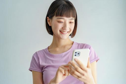 A woman looking at a smartphone screen in sportswear, স্মার্টফোনের, জুত, নারী, JPG