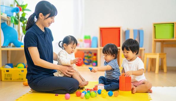 笑顔の保育士と遊ぶ子どもたち 笑顔の保育士と遊ぶ子どもたちの写真