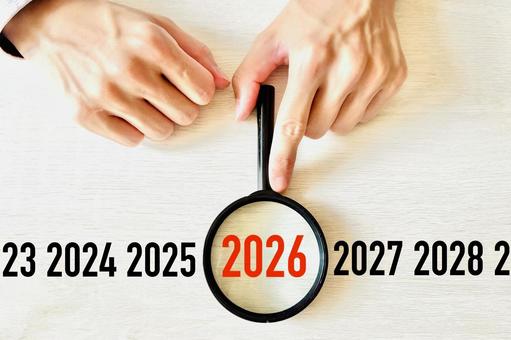 虫眼鏡で2026年の予想を分析する人 虫眼鏡で2026年の予想を分析する人 ビジネス,2026年,予想の写真素材