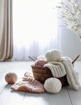 白いフローリングに毛糸玉の写真