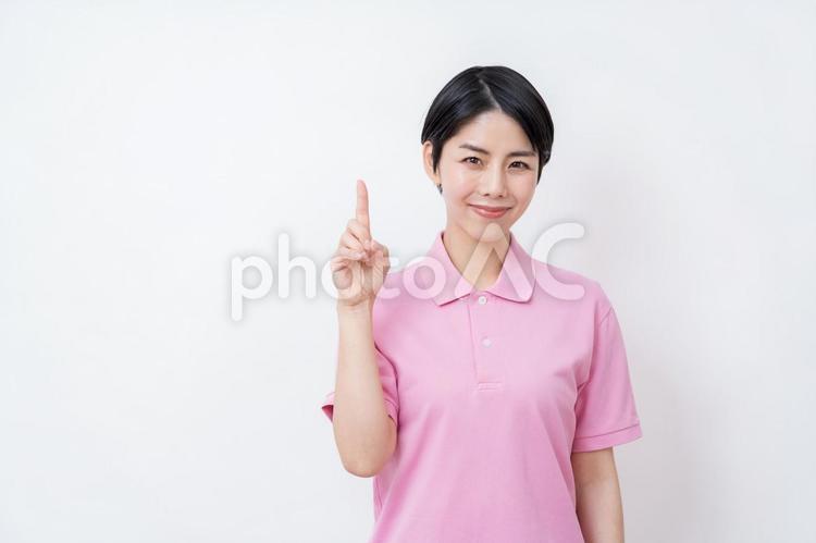 提案する介護福祉士の女性。 提案,紹介,推薦の写真素材