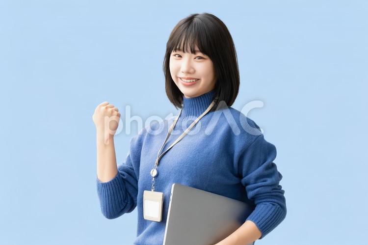ガッツポーズをする女性・ビジネスウーマン 女性,ガッツポーズ,笑顔の写真素材