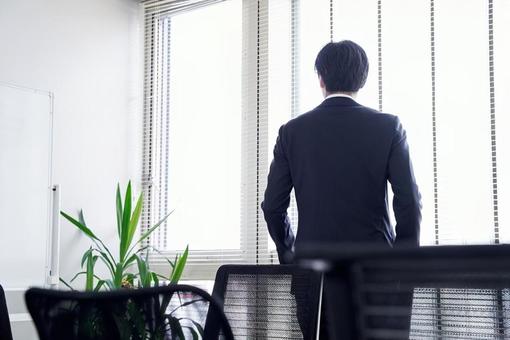 Japanese businessman looking out the window in the office, JPG Japanese businessman looking out the window in the office, male, businessman, rear view, JPG