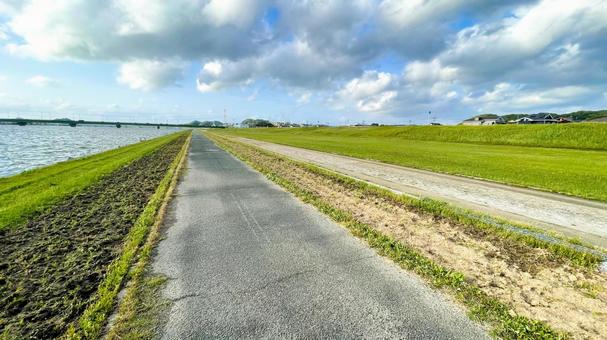 遠賀川の広々とした河川敷 遠賀川の広々とした河川敷 河川敷,遠賀川,草原の写真素材