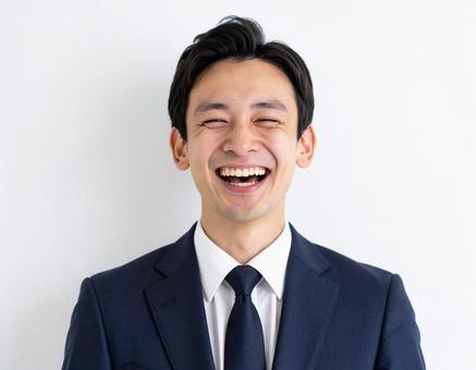 笑うビジネスマン 笑うビジネスマンの写真