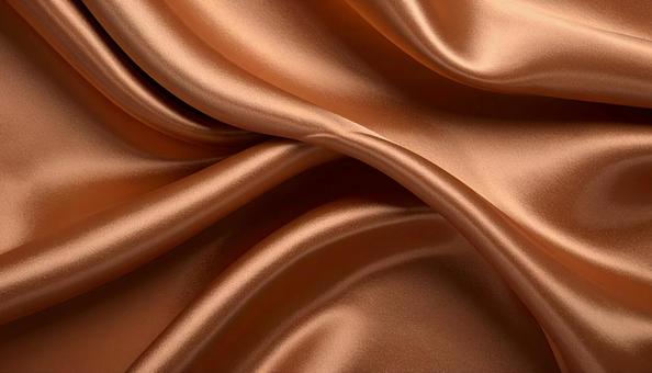 ドレープが美しいレンガ色のシルクの背景の写真