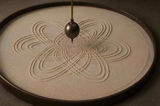 振り子が描く砂紋の写真