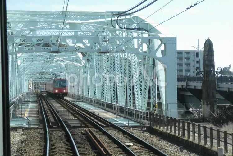 鉄橋を渡る名鉄 名鉄,名古屋鉄道,鉄橋を渡る電車の写真素材
