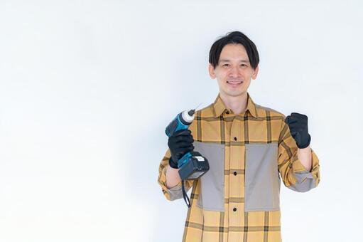 電動ドリルを持つDIY作業員 diy,職人,作業員の写真素材