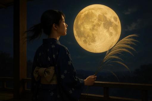 満月を眺める浴衣姿の女性とススキ 満月を眺める浴衣姿の女性とススキの写真