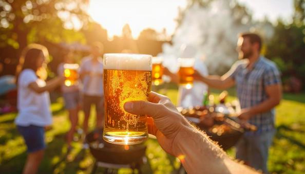 ビールで乾杯するバーベキュー ビールで乾杯するバーベキューの写真