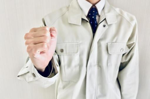 こぶしを握る男性作業員 気合い,健康,元気の写真素材