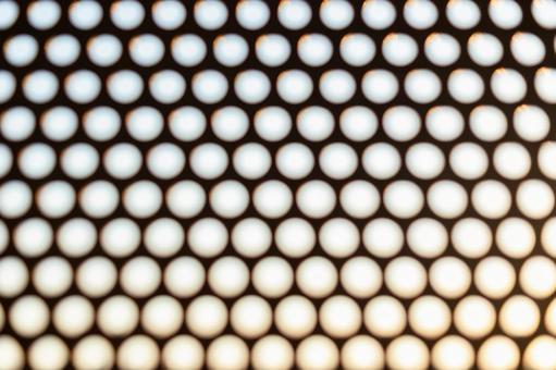 ハニカムが並ぶ玉ボケテクスチャ 玉ボケ,水玉,ドットの写真素材