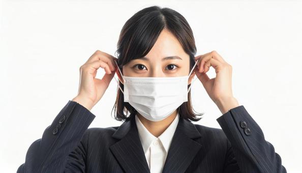マスクをつける人 マスクをつける人の写真