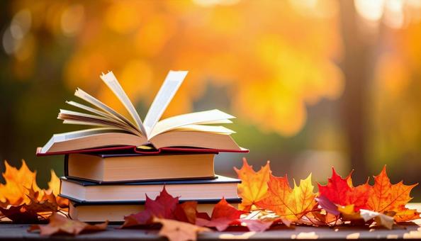 読書の秋 机の上の本 落ち葉の紅葉 読書の秋 机の上の本 落ち葉の紅葉の写真