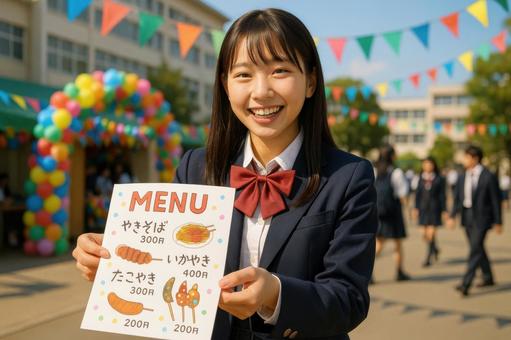 メニューを配る笑顔の女子生徒 メニューを配る笑顔の女子生徒の写真