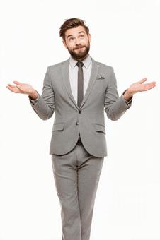 答えを待つような表情のスーツの男性 答えを待つような表情のスーツの男性の写真