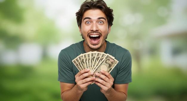 大金を手にして喜ぶ男性 大金を手にして喜ぶ男性の写真